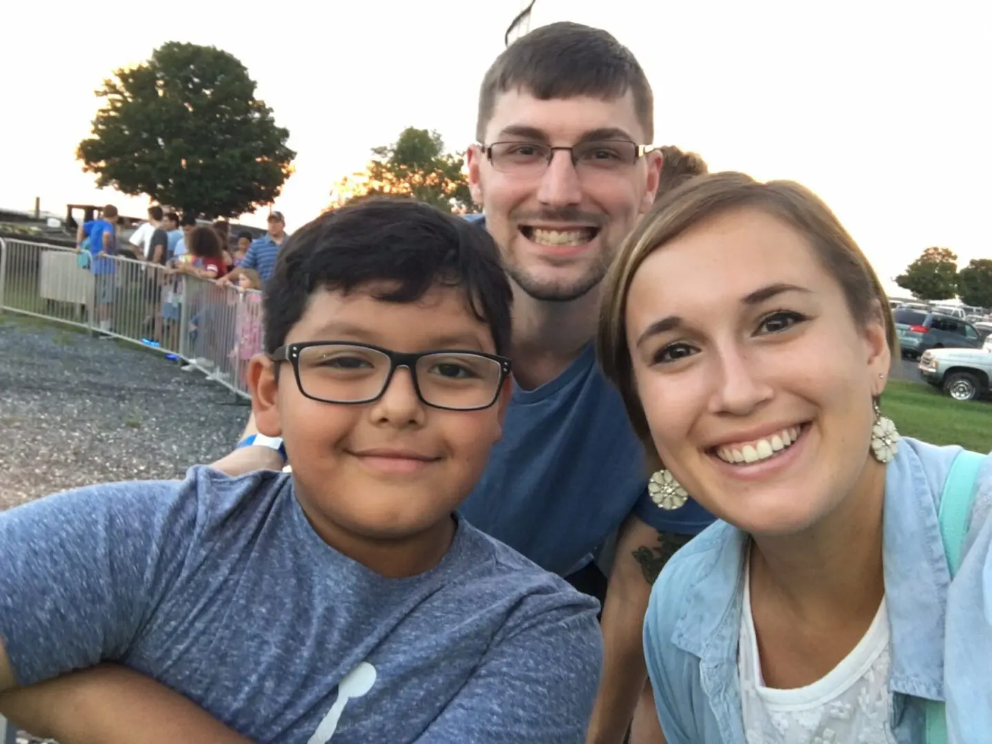 A family posing for the camera at an event.